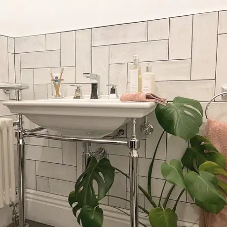 White Tiles around Bathroom Sink